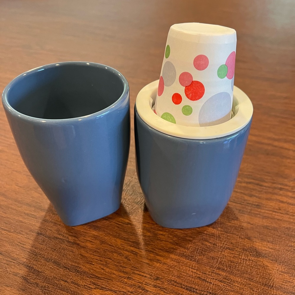 Ceramic toothbrush cup and spring loaded cup holder